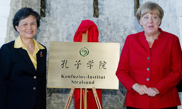 German Chancellor Angela Merkel (R) with Cheif Executive of CI Headquarters Xu Lin (L) at the opening event of Stralsund CI in Germany in Aug. 2016 (Photo- China Daily)