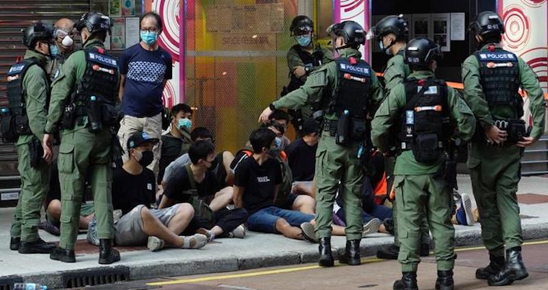 Police detain a group of protestors in Hong Kong in June 2020 (Photo-AP)