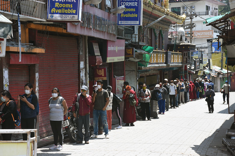 Tibetans in Dharamshala line up to recieve ration and other essentials. May 1, 2020. Phayul photo-Kunsang Gashon