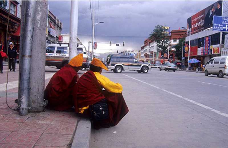 Two nuns by a street in Lhasa city (Photo courtesy Vijay Kranti)