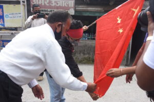 Activists burn the Chinese flag at McLeod Ganj’s main square protesting Chinese incursion in Ladakh and killing Indian soldiers. (June 18, 2020 Phayul photo-Kunsang Gashon).