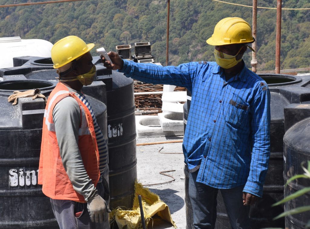 Construction workers undergoing temperature check in McLeod Ganj. April 25, 2020. Phayul photo- Kunsang Gashon